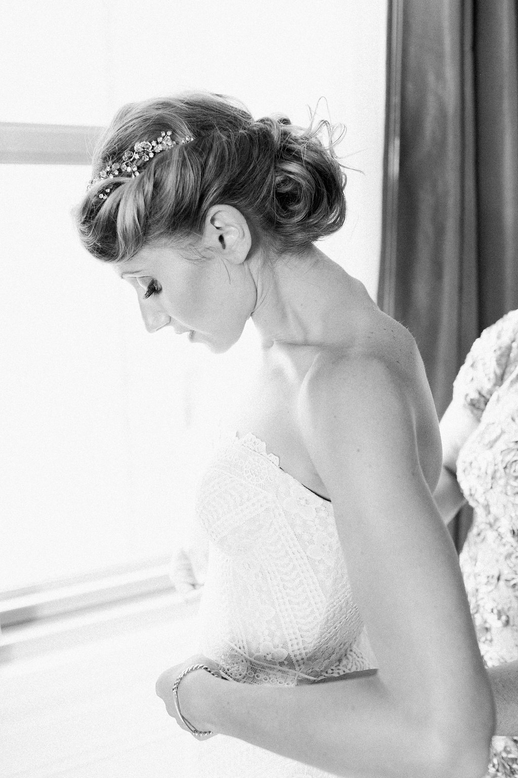 Bride is walked down the aisle by man who received her father's donated heart - Lauren Renee Photography Bride getting into her Rue de Siene wedding dress at the Omni William Penn Hotel