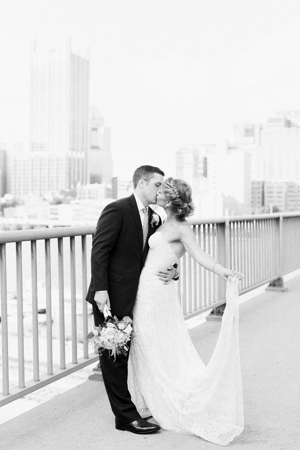 Bride is walked down the aisle by man who received her father's donated heart - Lauren Renee Photography Black and white photograph of the bride and groom on Smithfield Street Bridge overlooking Pittsburgh city skyline