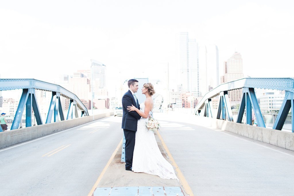 Bride is walked down the aisle by man who received her father's donated heart - Lauren Renee Photography Photo of the bride and groom standing on Smithfield Street Bridge