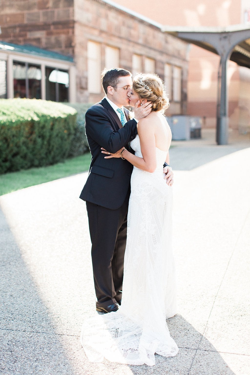 Bride is walked down the aisle by man who received her father's donated heart - Lauren Renee Photography Photo of the bride and groom kissing outside the Grand Concourse at Station Square