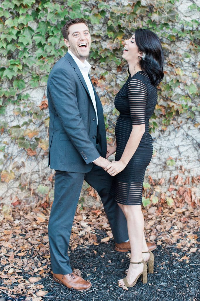 Mount Washington and South Side Engagement Couple posing in front of vines at Station Square in Downtown Pittsburgh