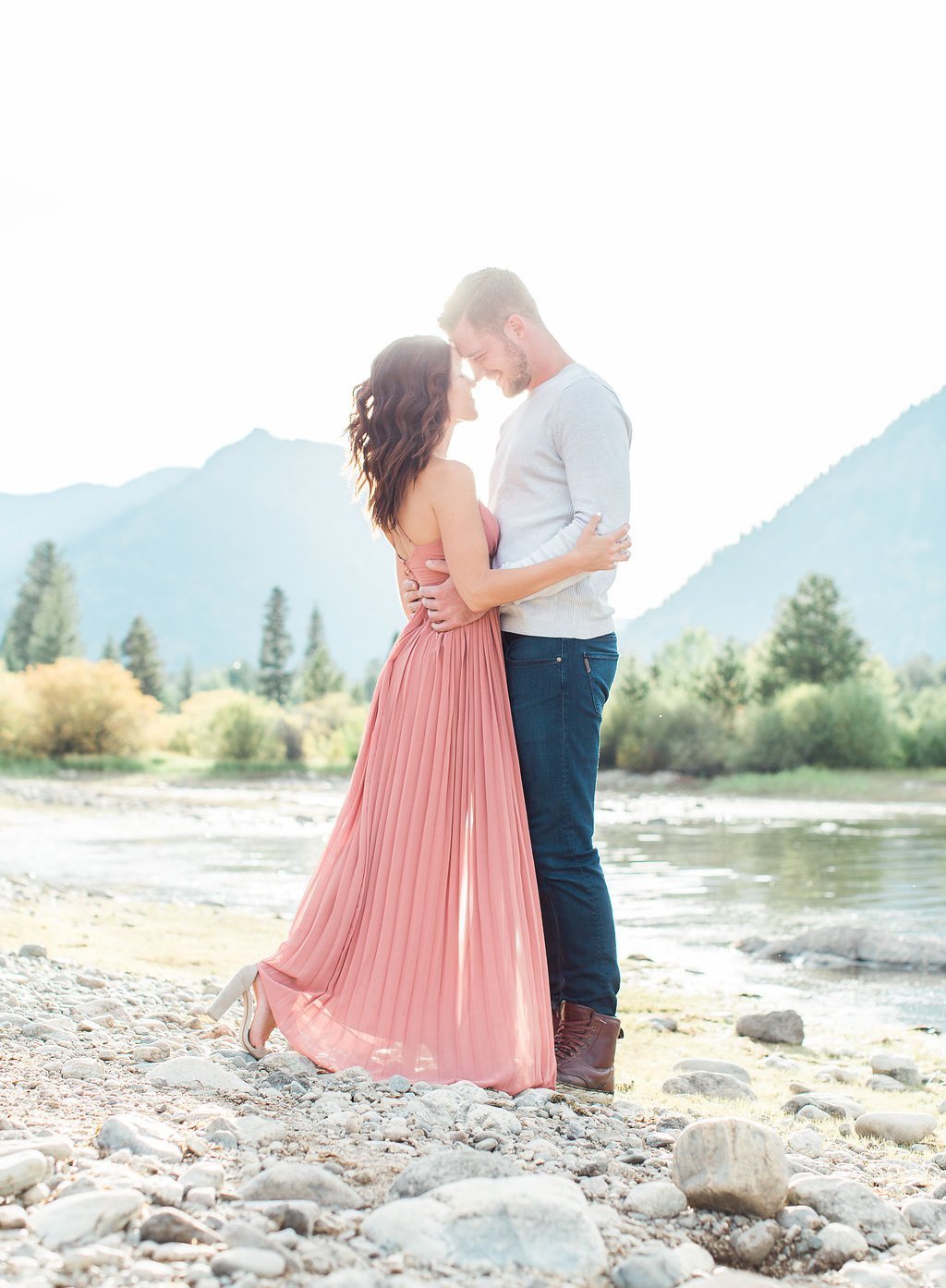 Destination Engagement Session - Lauren Renee Photography Bride wearing pink and groom near the lake embracing