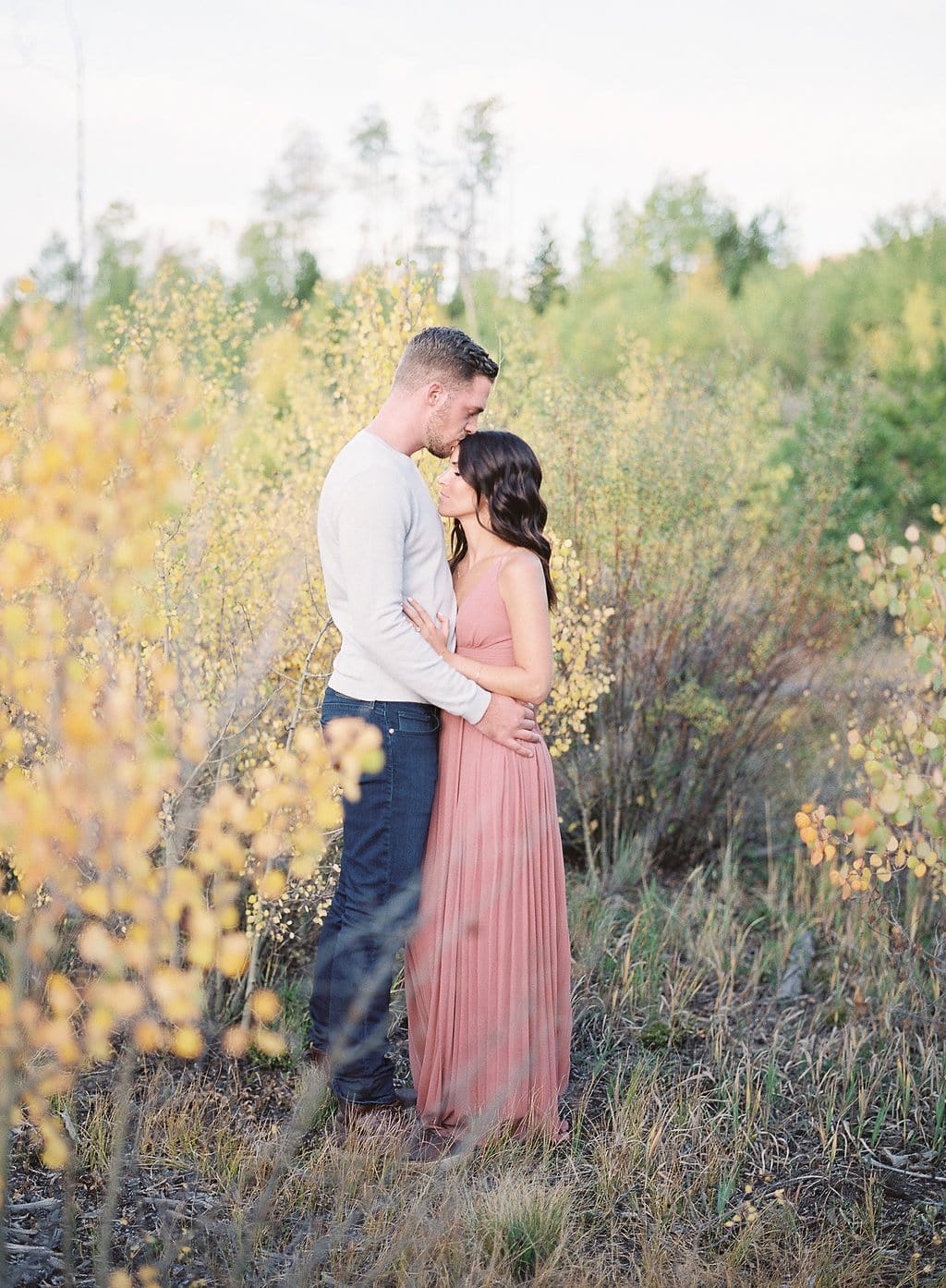 Destination Engagement Session - Lauren Renee Photography groom and bride embracing amongst the fall leaves