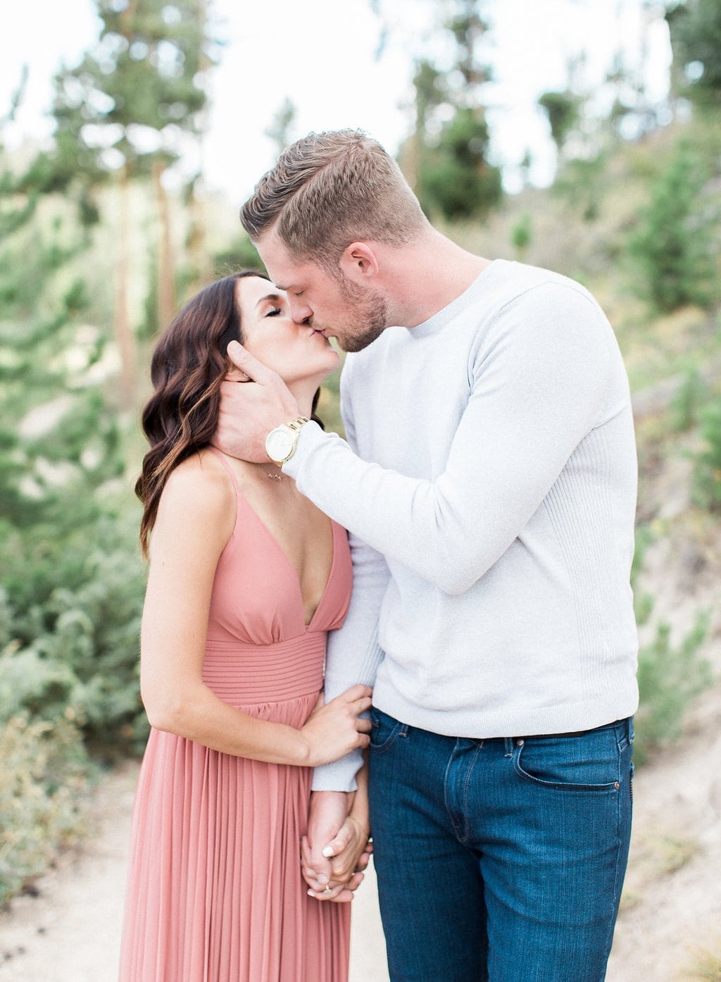 Destination Engagement Session - Lauren Renee Photography groom and bride kissing while holding hands