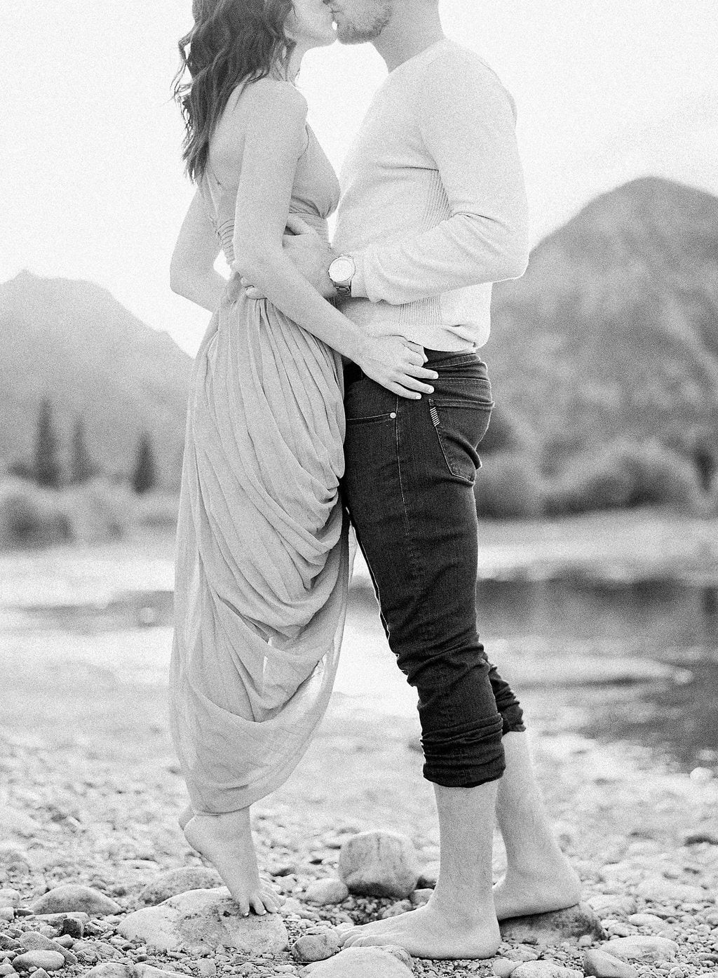 Destination Engagement Session - Lauren Renee Photography bride standing on her toes to kiss her groom black and white