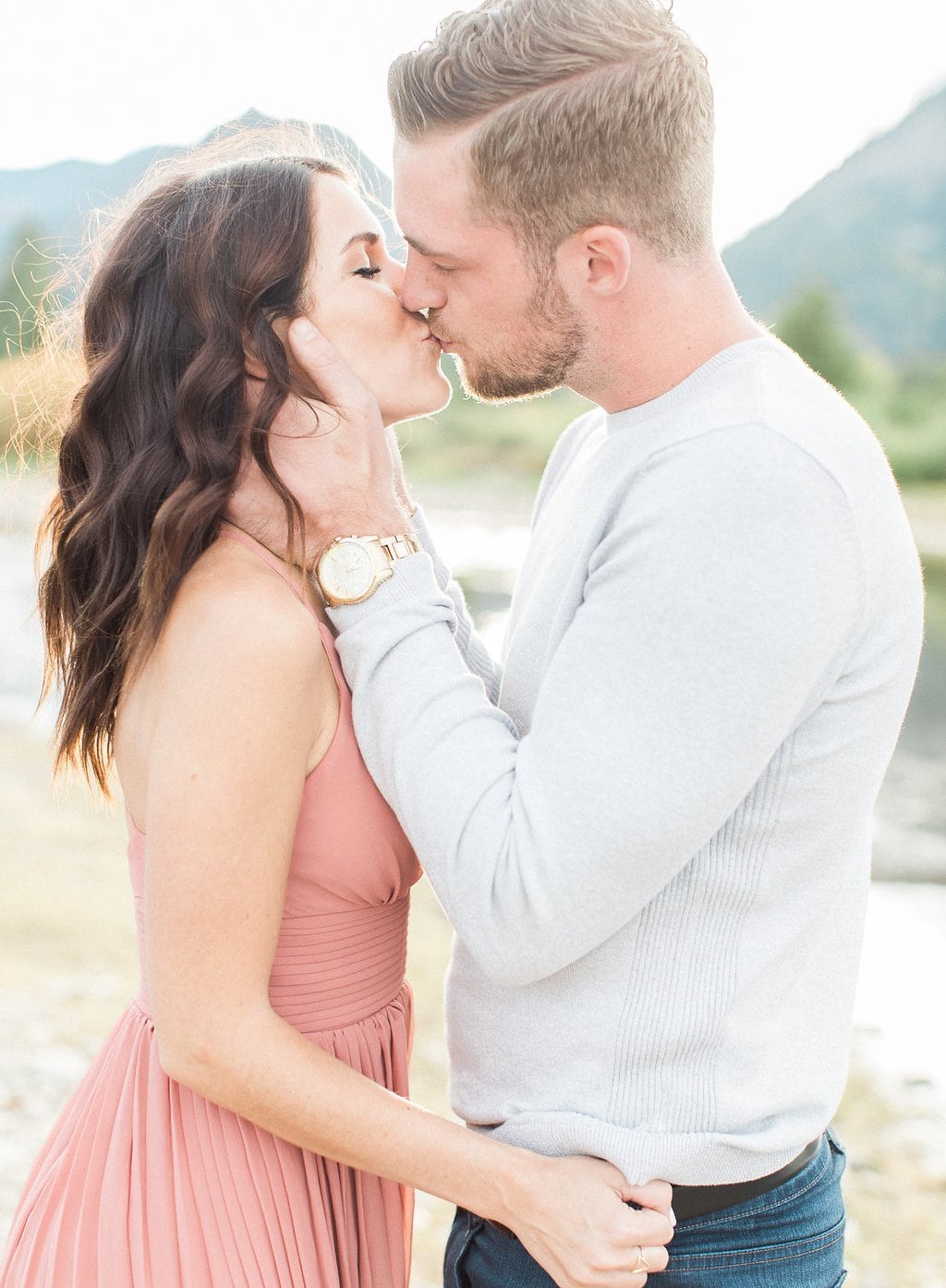 Destination Engagement Session - Lauren Renee Photography bride wearing pink dress and kisses groom