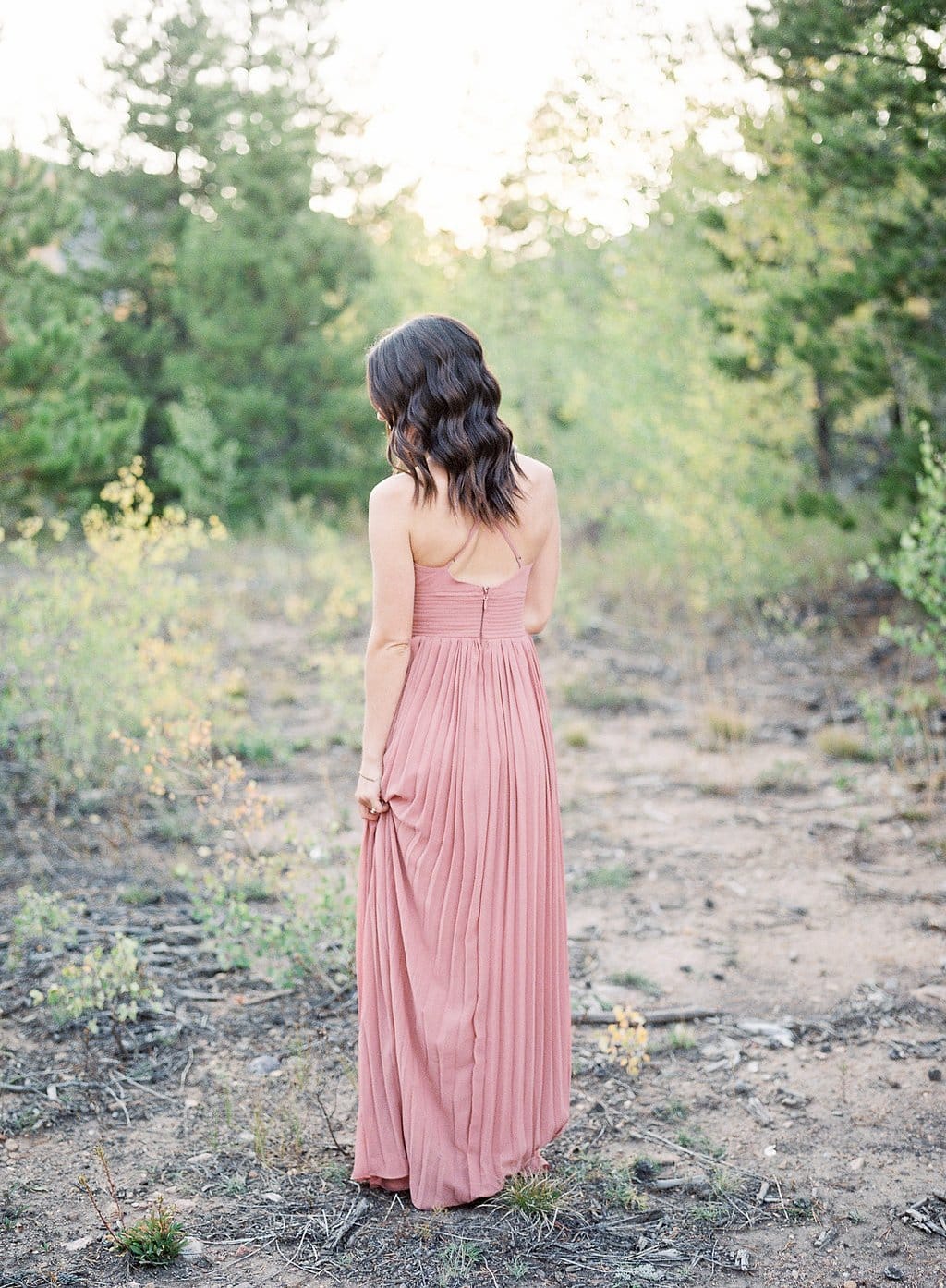 Destination Engagement Session - Lauren Renee Photography Bride wearing a pink dress and standing in Colorado dessert
