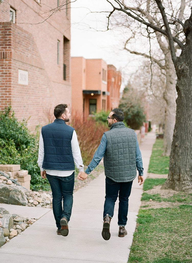 Sam-Sex Engagement Session - Lauren Renee Photography two gay men walking and holding hands in Denver