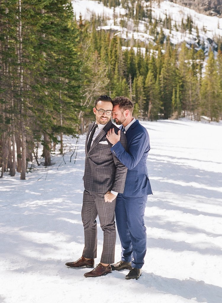 Estes Park Engagement Photography - Lauren Renee Photography two men embracing in the snow in the mountains in suits