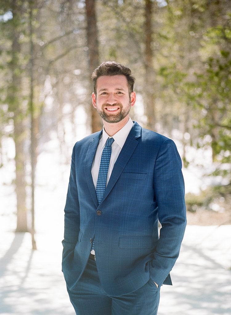 Sam-Sex Engagement Session - Lauren Renee Photography portrait of man in blue suit in the snow on film