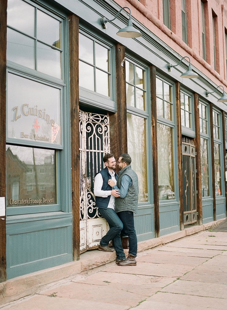 Sam-Sex Engagement Session - Lauren Renee Photography gay couple posing on the streets of downtown Denver