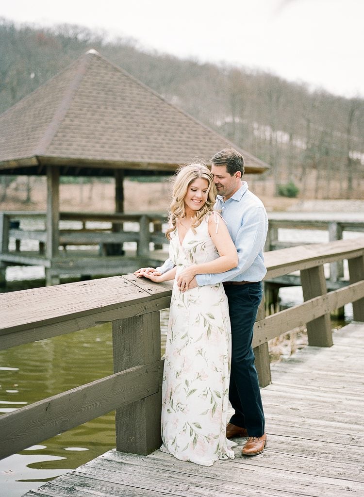 Seven Springs Engagement Photography - bride and groom standing near a dock laughing
