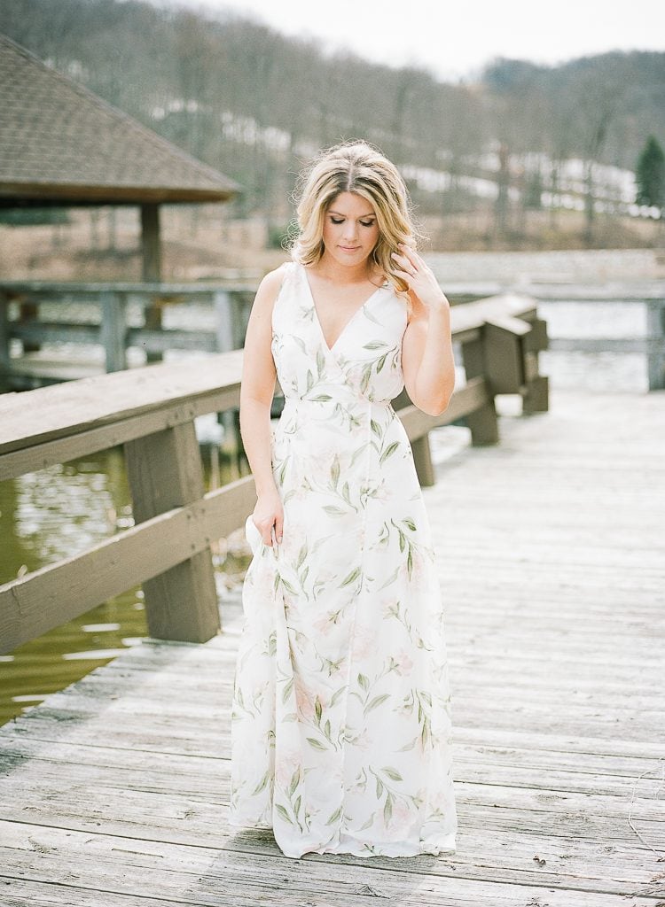 Seven Springs Engagement Photography - bride posing and playing with hair on a dock