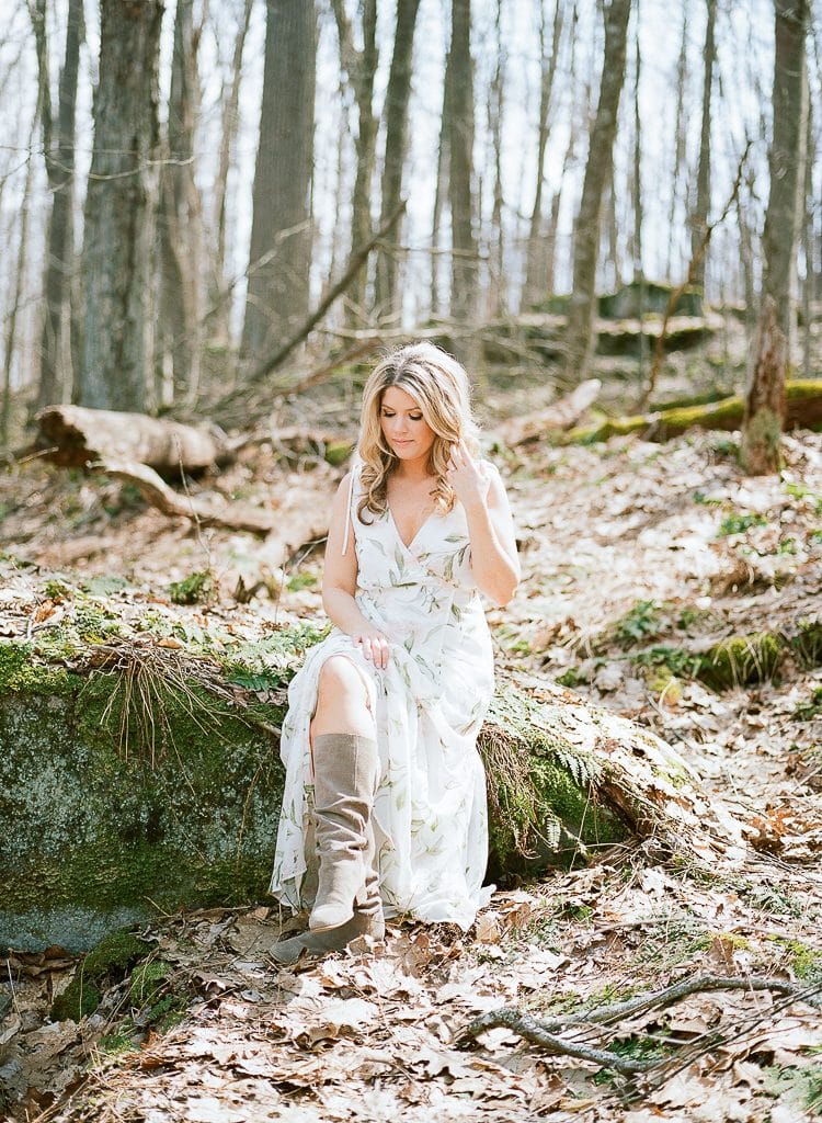 Seven Springs Engagement Photography - bride sitting on a rock in the woods