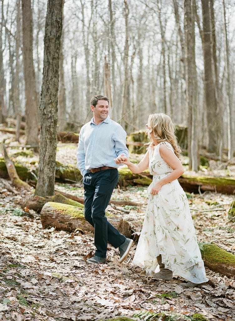 Seven Springs Engagement Photography - bride and groom walking in the woods holding hands