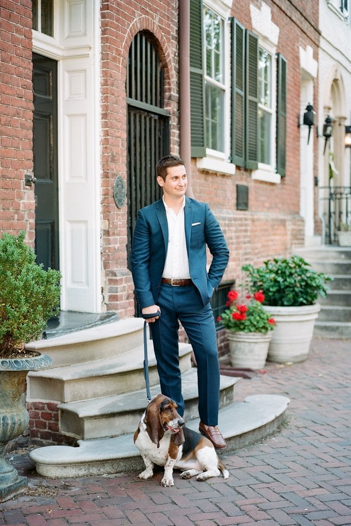 Engagement Session - Lauren Renee Photography Young man standing on a stoop in a suit with his hound dog