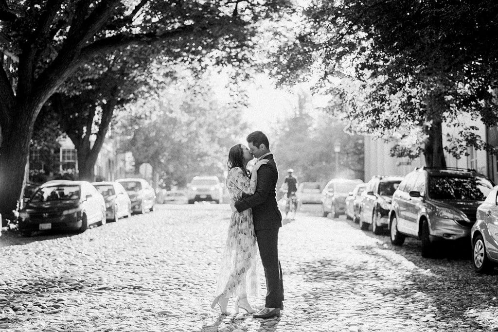 Engagement Session - Lauren Renee Photography Couple kissing on a cobble stone street in Old Town Alexandria Virginia