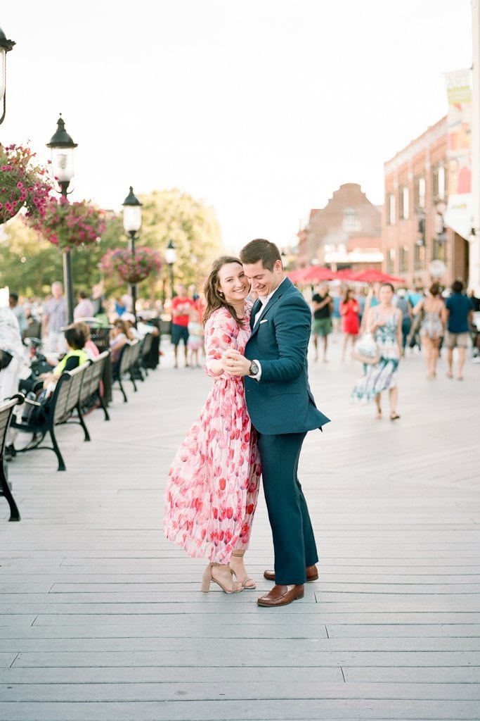 Engagement Session - Lauren Renee Photography Couple dancing and holding hands on the dock in Old Town Alexandria
