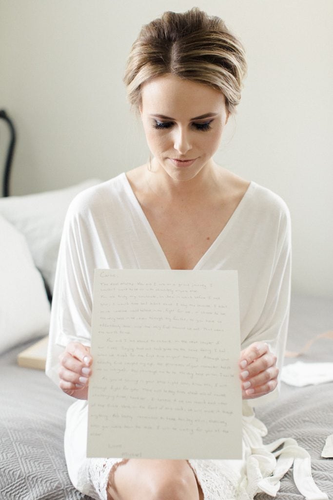 The Pennsylvanian Bride opening up gift from groom