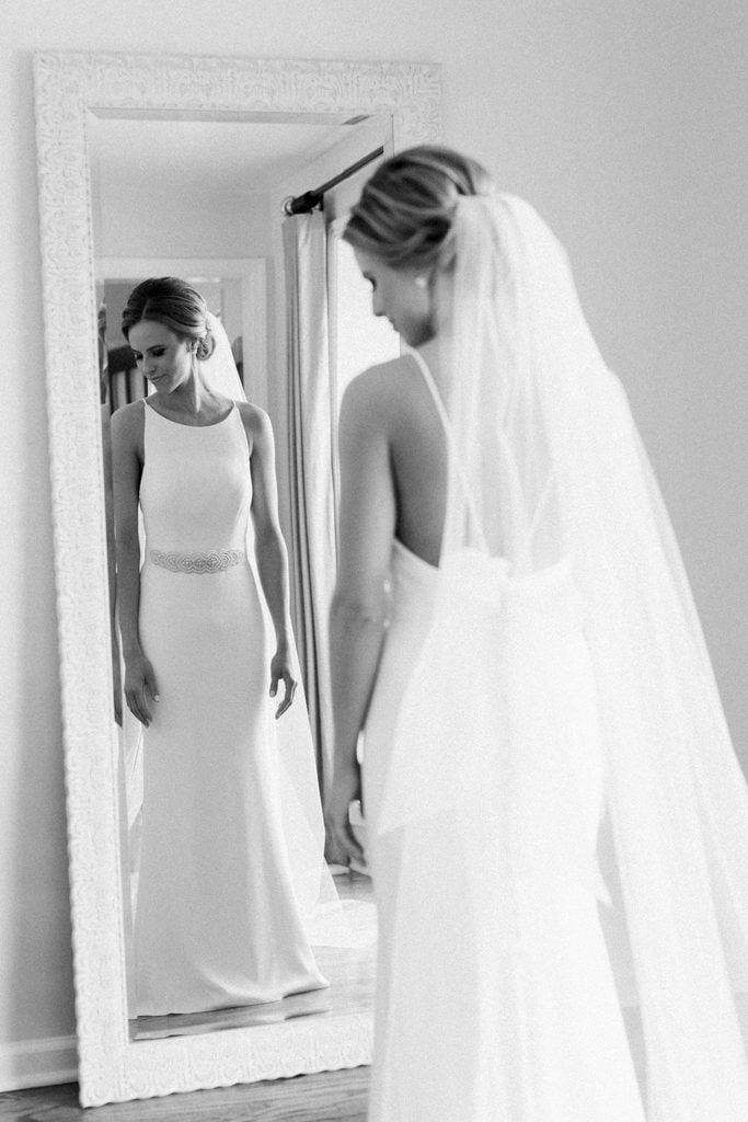 The Pennsylvanian Wedding bride getting ready in Mikaella by Paloma Blanca dress