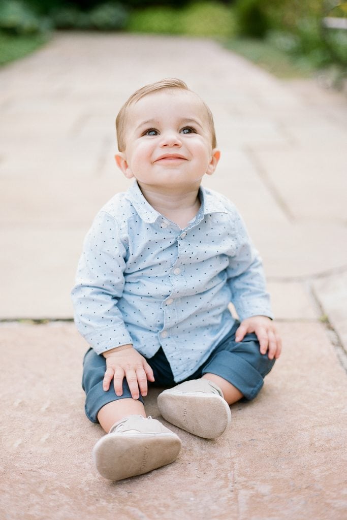 Baby smiling for photos during Family Session at The Walled Garden