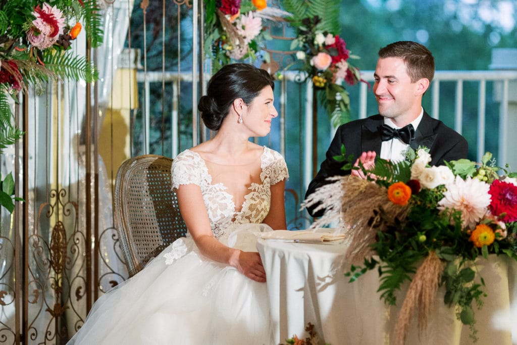 The bride and groom during speaches looking at each other