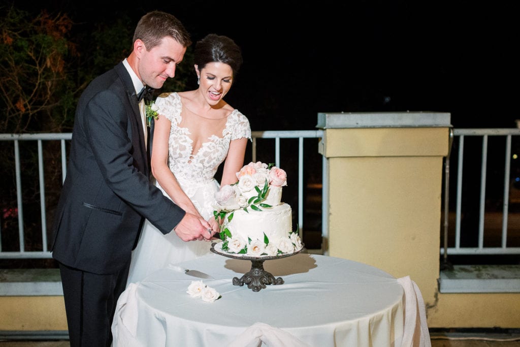 Cutting the cake at their wedding reception at the walled garden