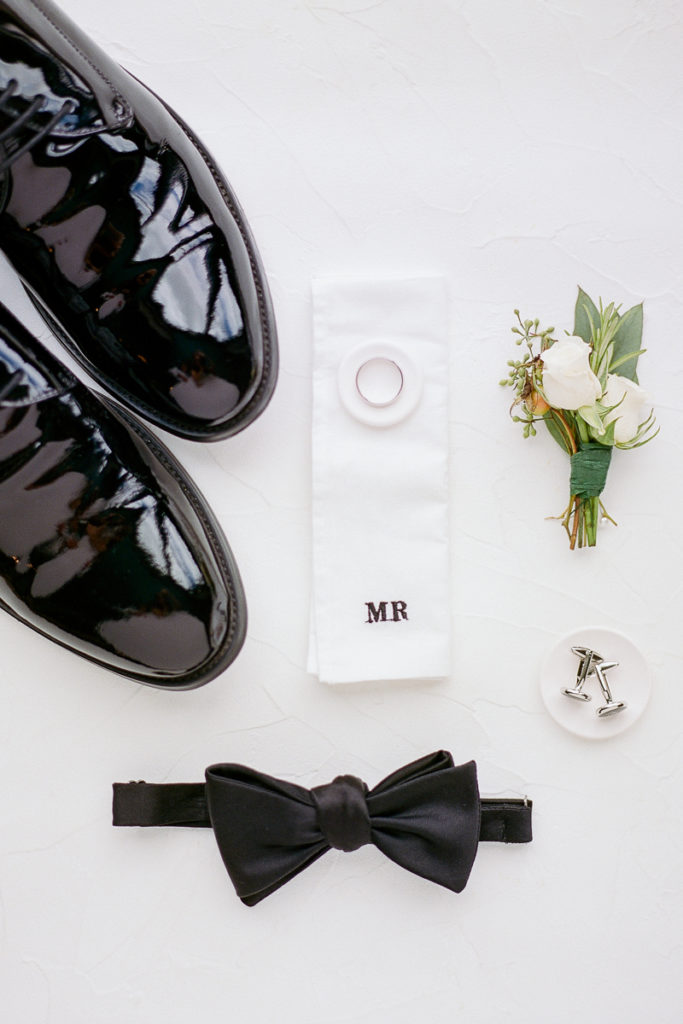 Groom's details with bow tie and cufflinks