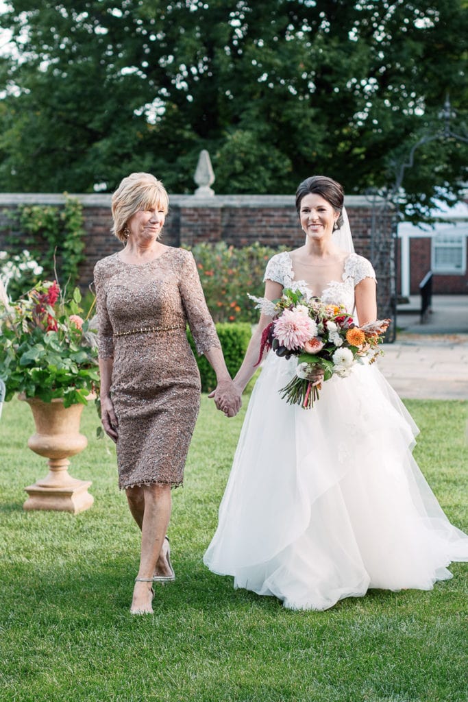 Bride walking down the aisle towards her groom