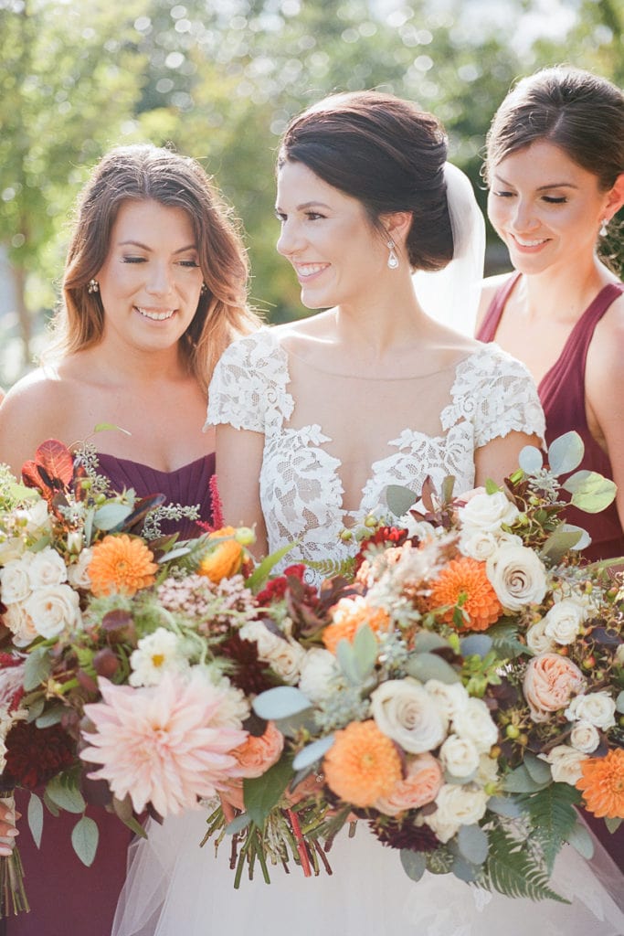 Bride with her bridesmaids holding bouquets from the Farmer's Daughter