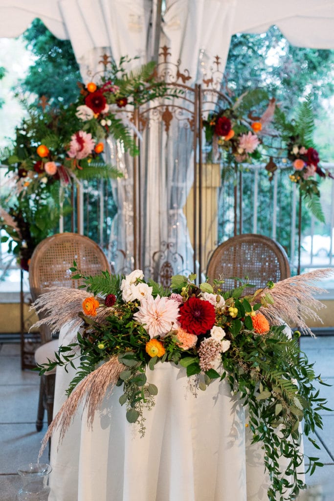 Head table decorated with beautiful fall colors at the Pittsburgh Center for the Arts