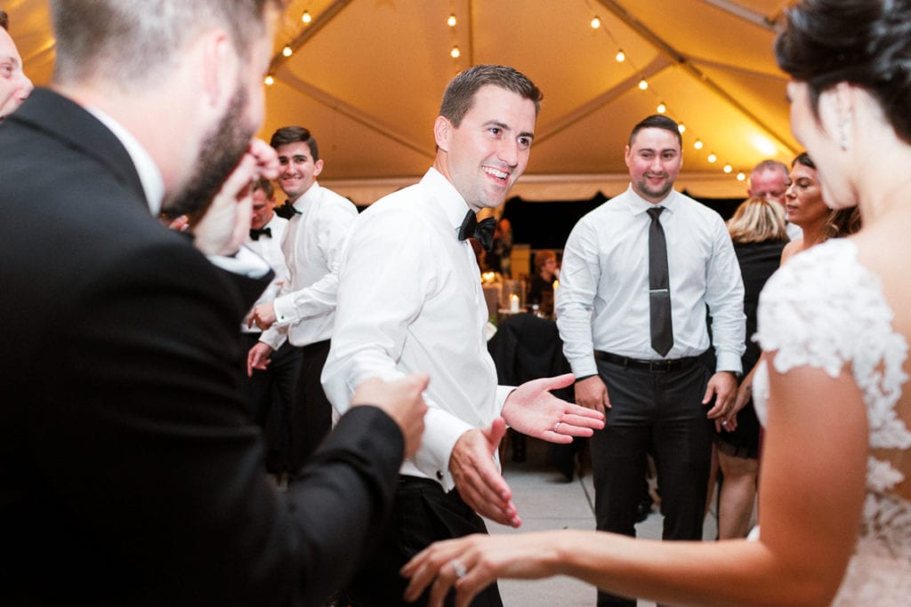 Bride and groom dancing together at wedding reception