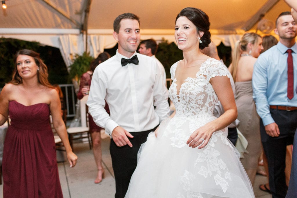 Bride and groom dancing together at wedding reception