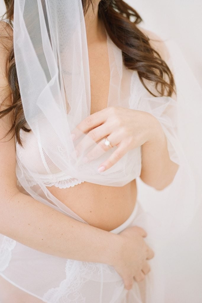 woman wrapped in bridal veil wearing white lingerie: Pittsburgh Boudoir Photography