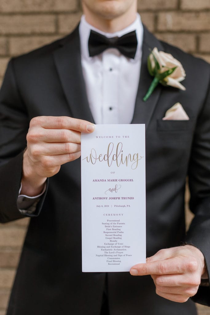 Wedding program held by a groomsman at the Renaissance