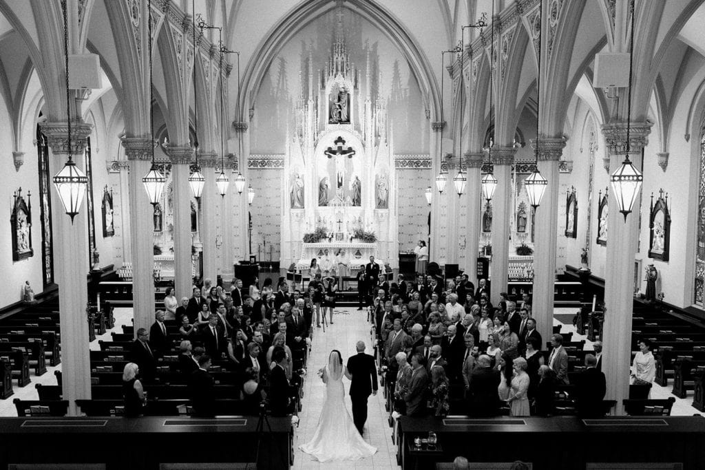 Bride walking down the aisle towards her groom