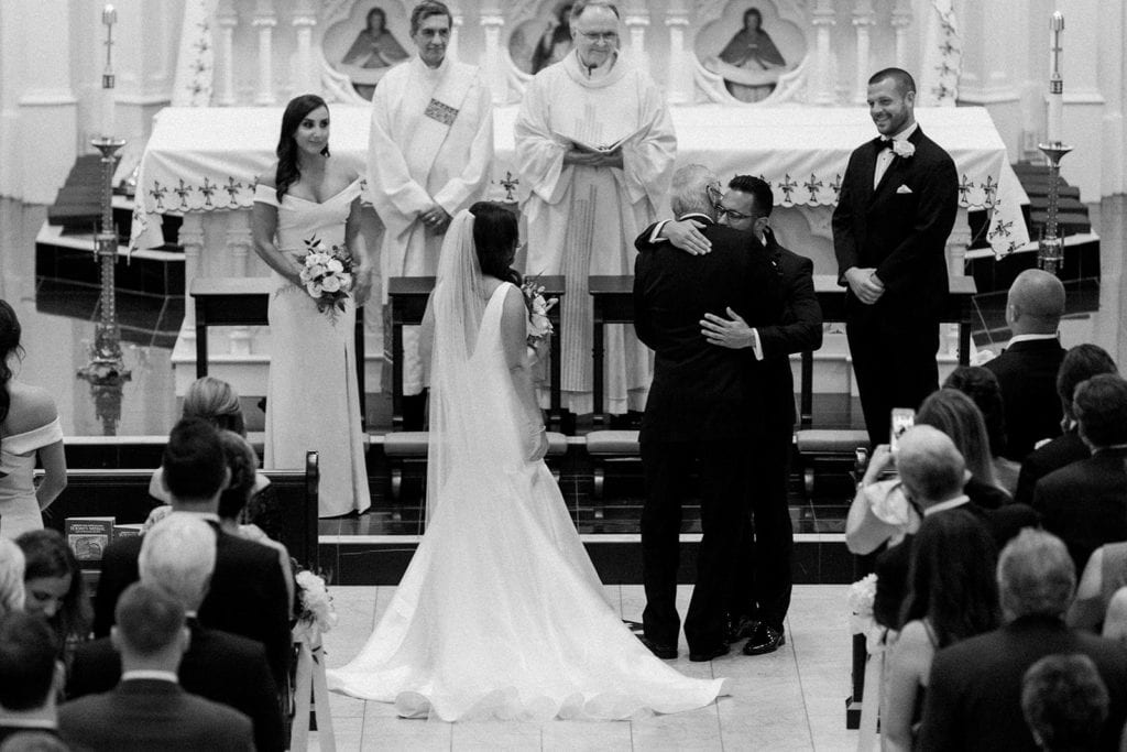 Father of the bride giving his daughter away at St Peter's Parish