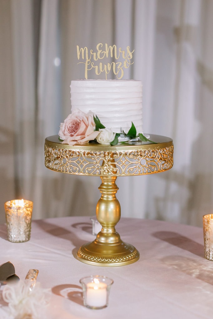 Wedding cake from Oakmont bakery with gold topper