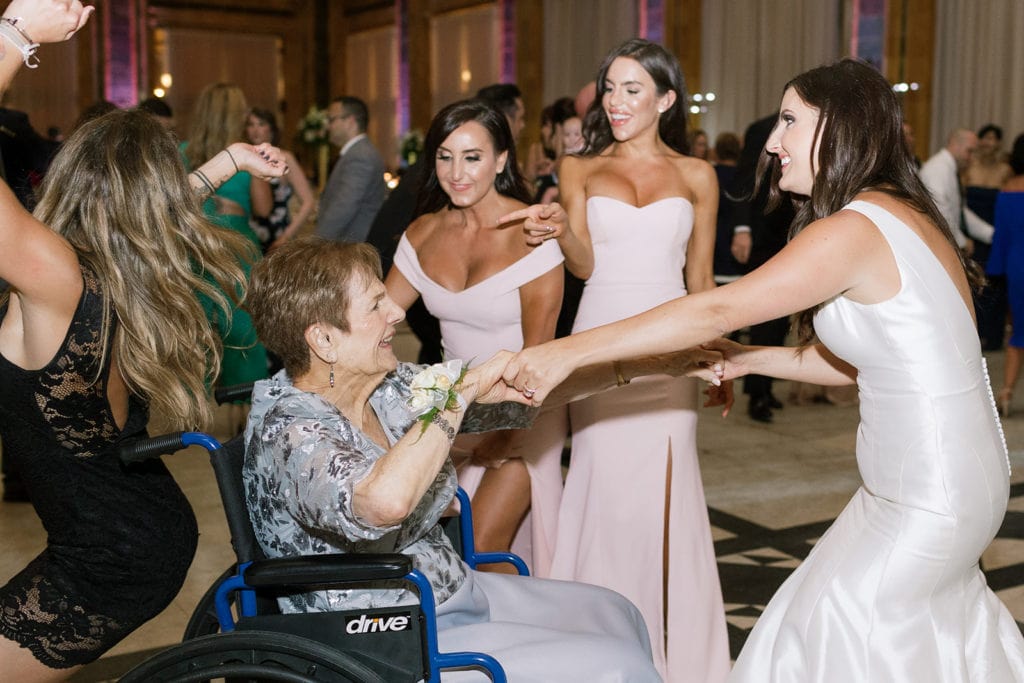 Wedding guests dancing with grandma inside the Pennsylvanian