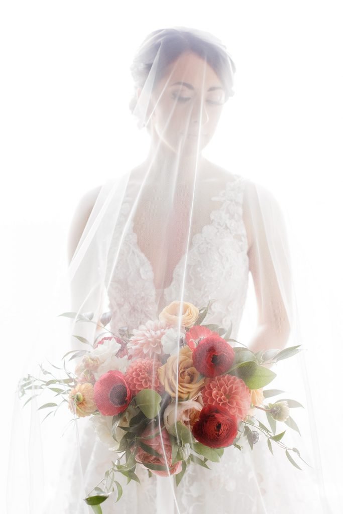 Bridal portrait with bouquet by Sapphire and Lace captured by Pittsburgh wedding photographer Lauren Renee