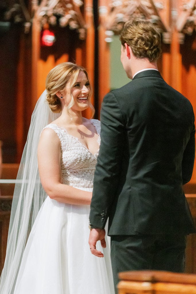 Bride and groom exchanging rings at Heinz Chapel