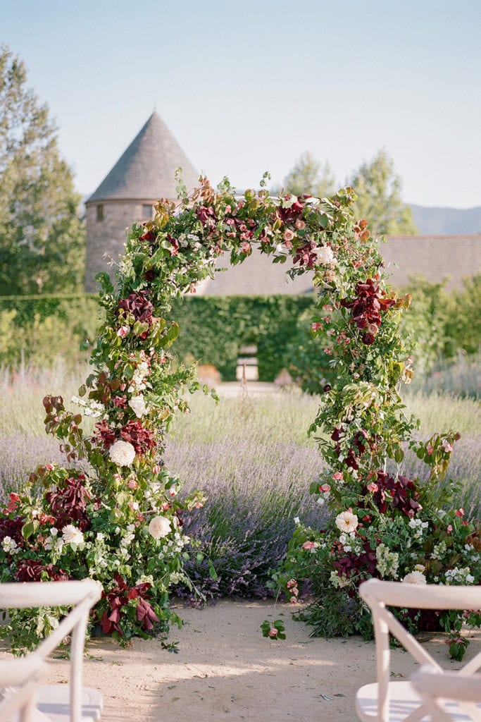 Ceremony Arch with flowers by Emily Reynold Design: Kestrel Park California Wedding Inspiration Styled Shoot captured by Pittsburgh Wedding Photographer Lauren Renee