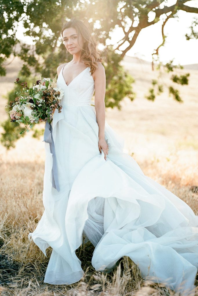 Carol Hannah Bridal Dress Ceremony Arch with flowers by Emily Reynold Design: Kestrel Park California Wedding Inspiration Styled Shoot captured by Pittsburgh Wedding Photographer Lauren Renee