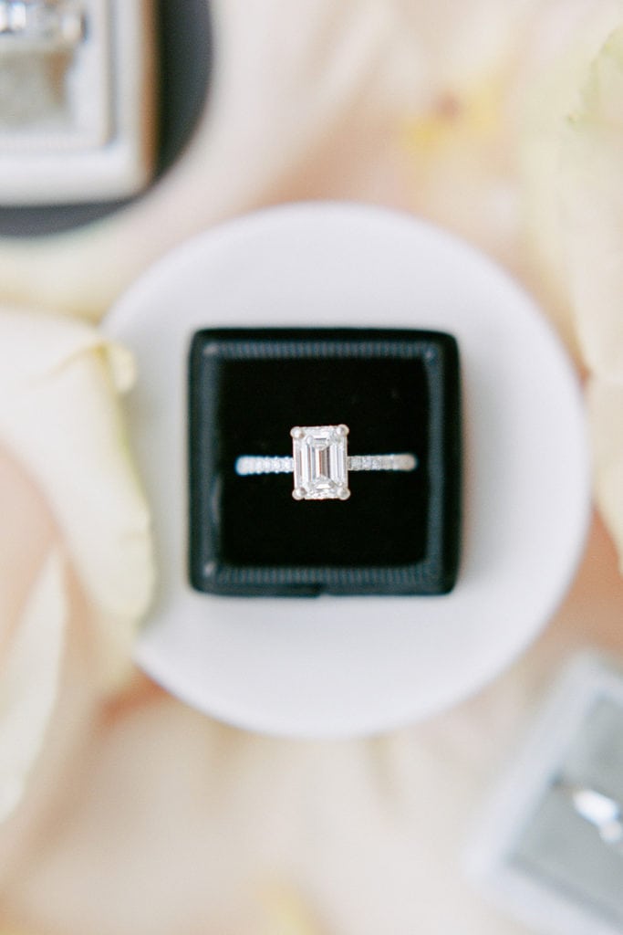 Close up of engagement ring in a black mrs. box