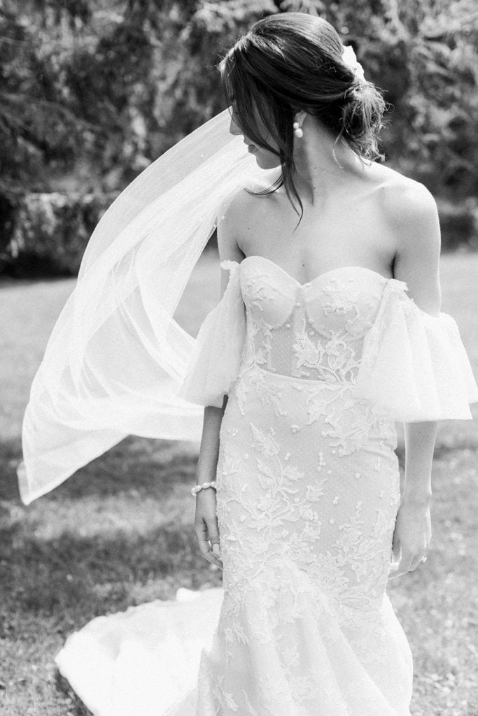 Bride getting into her Berta Bridal Dress