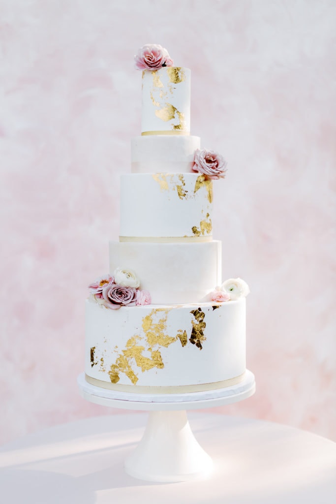 Tasty Bakery three tiered wedding cake with Lindale Studios pink backdrop