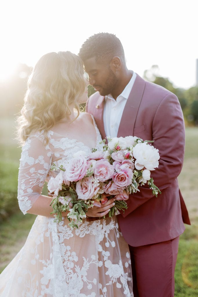 Bride and groom romantic portraits outside of Phipps Conservatory wedding venue at sunset