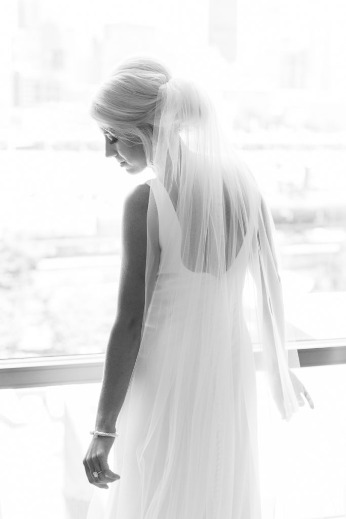 Bride with veil getting ready on her wedding day