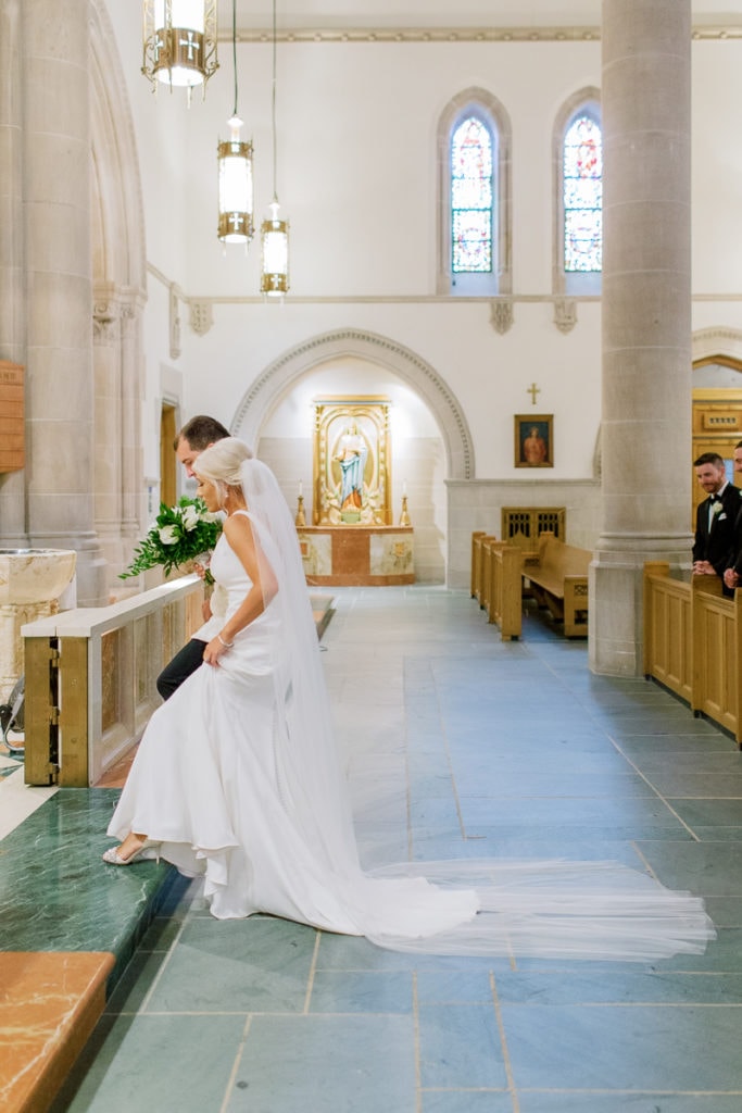 Bride and Groom walking up to the altar