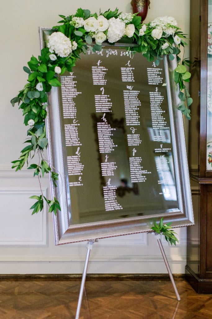 Mirror display escort cards with flowers